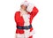 Old senior man with grey hair and long beard wearing traditional santa claus costume touching forehead for illness and fever, flu