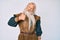 Old senior man with grey hair and long beard wearing viking traditional costume doing happy thumbs up gesture with hand