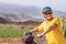 Old senior woman enjoying outdoor excursion with bicycle and healthy lifestyle. Elderly smiling woman wearing sport helmet in