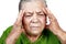 Old senior woman having migraine or headache