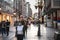 Old senior woman wearing a respiratory face mask walking in a crowded street of Belgrade, during the coronavirus covid 19 crisis