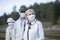 Old  seniors people with face masks waiting train before traveling during a pandemic