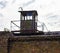 Old sentry-box on the industrial plant brick wall