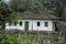 Old settler house in green landscape