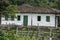 Old settler house in green landscape