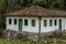 Old settler house in green landscape