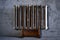 Old shabby cast iron household hot-water heating radiator