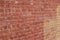 Old shabby chic pink and beige color brick wall texture with a blotchy abstract look