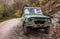 Old shabby terrain car in nature