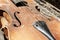 Old shabby vintage violin. Close-up part image with upper bout, F-holes, waist