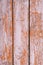 Old shabby wooden fence painted faded brown