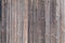 Old shabby worn wooden boards - background, wall of vintage house. Rural texture