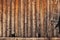 Old shabby worn wooden boards - background, wall of vintage house. Rural texture