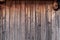 Old shabby worn wooden boards - background, wall of vintage house. Rural texture