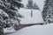 Old shelter in the winter mountains during a long snowstorm