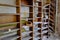 Old shelves for papers in an abandoned room. Rubbish and papers scattered around the room