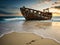 Old ship. Old destroyed ship on the shore. Wooden abandoned ship at sunset