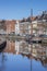 Old ship and warehouses along a canal in Groningen