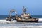 Old shipwreck Zeila at the Atlantic Coast between Swakopmund and Henties Bay along the famous Skeleton Coast in Namibia, Africa.