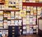 Old shoe boxes on store shelves, selective focus