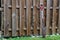 Old shovel leaning against fence