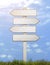 Old signpost white direction decision in summer