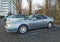 Old silver grey Honda Prelude 2.0 sport car parked under naked trees