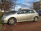 Old silver grey popular car Toyota Corolla hatchback parked