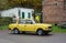 Old simple cheap east German car Wartburg driving at a car show