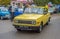 Old simple cheap east German car Wartburg driving at a car show