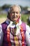 Old Slavic woman in national dress. Russian granny in a scarf.