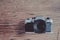 Old  SLR Film camera on wood background