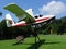 An old small Air Whitsunday float plane with a high mounted propellor and engine