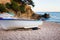 Old small boats on sandy beach. Weathered and