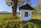 Old small chapel of Pensive Christ in autumn sunny day, Skwirtne village, Low Beskids Beskid Niski, Poland.