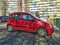 Old small compact city car red Fiat Panda parked.