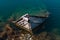 Old Small Mediterranean Fishing Boat Sinking inside the Pier of Nea Artaki in Euboea - Nea Artaki, Greece