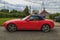 Old small red convertible car Mazda MX-5 parked