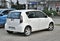 Old small white car Subaru Justy fourth generation parked closeup hatch view