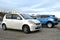 Old small white car Subaru Justy fourth generation parked right side front view