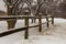 old snow-covered fence