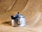 An old soldier\\\'s aluminum teapot from the Second World War against the background of burlap