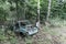 Old Soviet car. Broken car in the woods