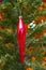 Old Soviet Christmas tree toy icicle hangs on a Christmas tree
