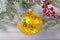 Old soviet decoration on the Christmas tree  glass toy gold ball close up on light background