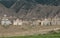 Old Soviet era cemetery with rusting tombs in the alpine desert near Bokonbayevo, Kyrgyzstan