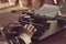 Old Soviet mechanical retro typewriter in the hands