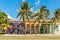 Old Spanish colonial colorful houses with palms in the foregroun