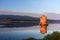 Old Spanish windmill in lagoon Orbetello on peninsula Argentario at sunise. Italy