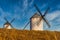 Old spanish windmills on a sunny day with clouds, Campo de Criptana, Spain